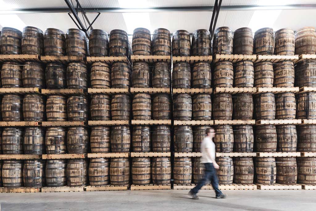 Large stacks of whiskey barrels inside the Midleton distillery Ireland