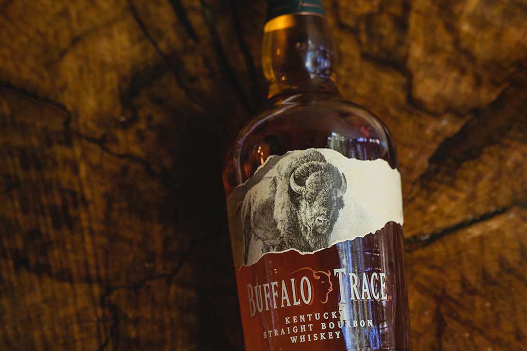 Bottle of Buffalo Trace bourbon on wood table