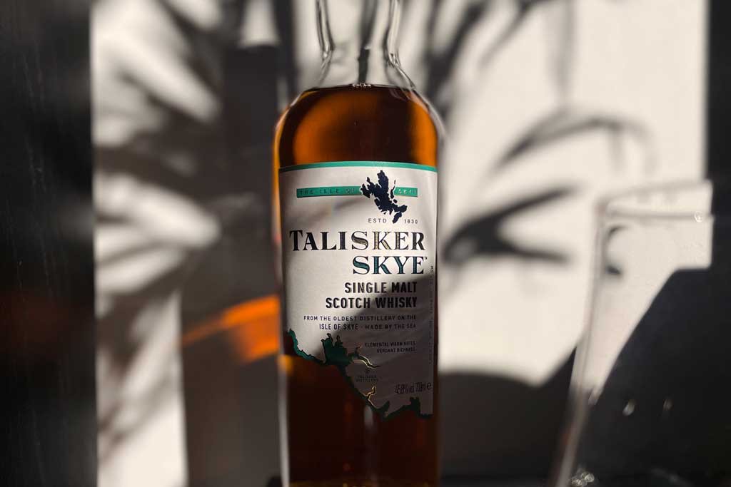 Bottle of Talisker Skye whisky in bright sunlight