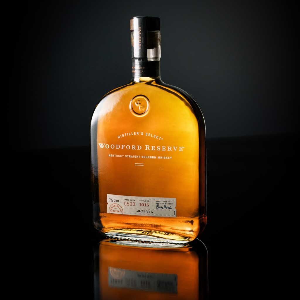Bottle of Woodford Reserve bourbon in dark room