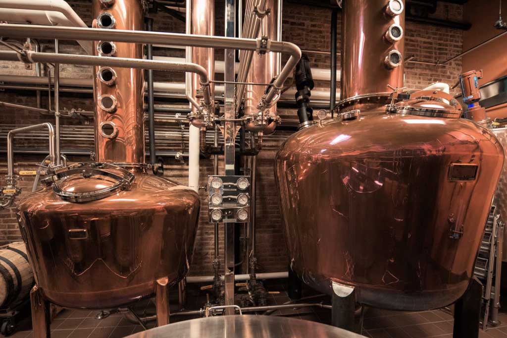 Copper stills inside Evan Williams distillery