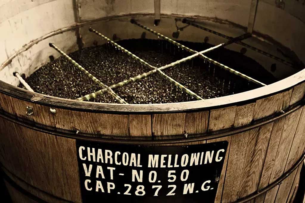 Large wooden vat of charcoal for mellowing Jack Daniels whiskey