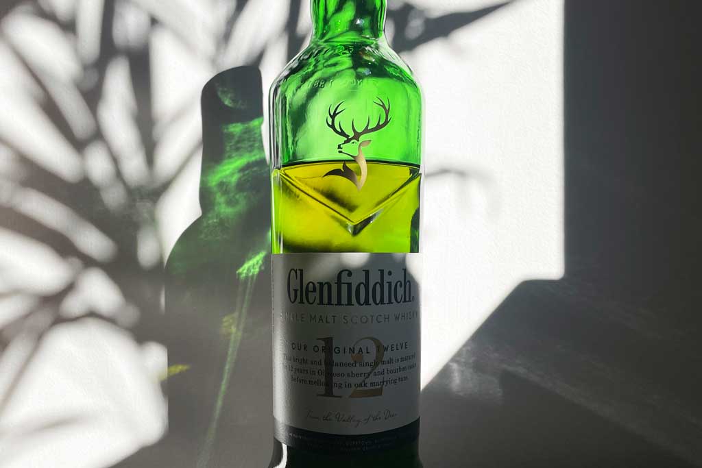 Bottle of Glenfiddich 12 year old whisky in bright sunlight
