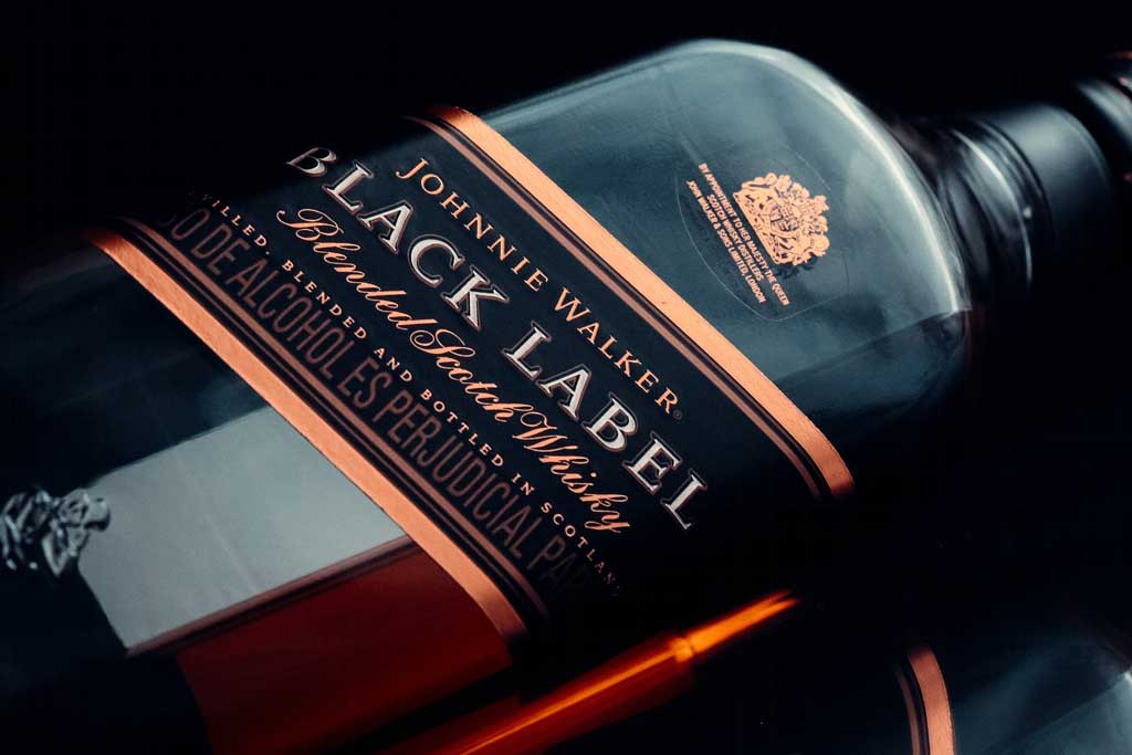 Close view of Johnny Walker Black Label whisky bottle on its side