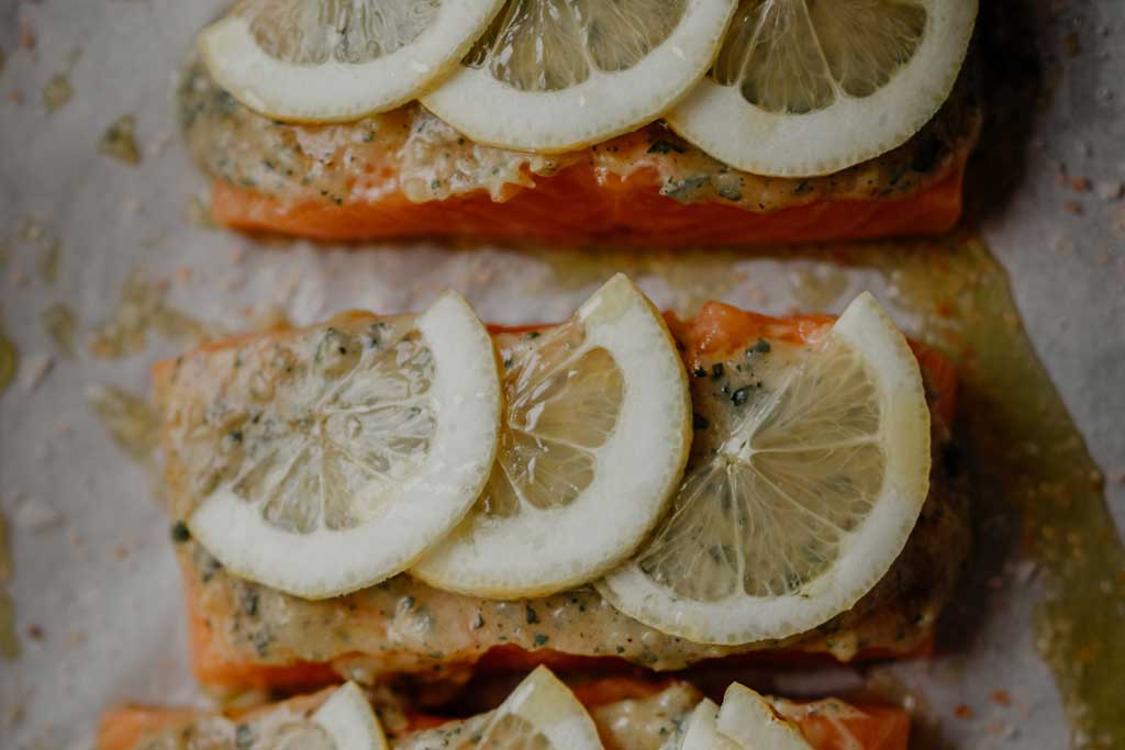 Salmon fillets with slices of lemon on top