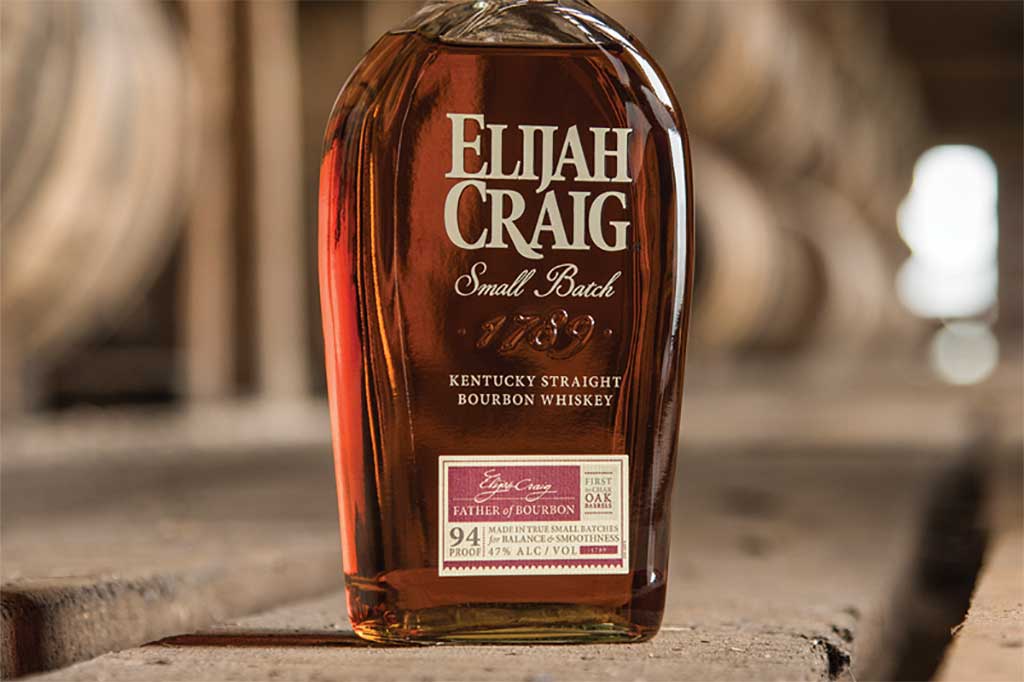 Bottle of Elijah Craig small batch bourbon whiskey in rickhouse