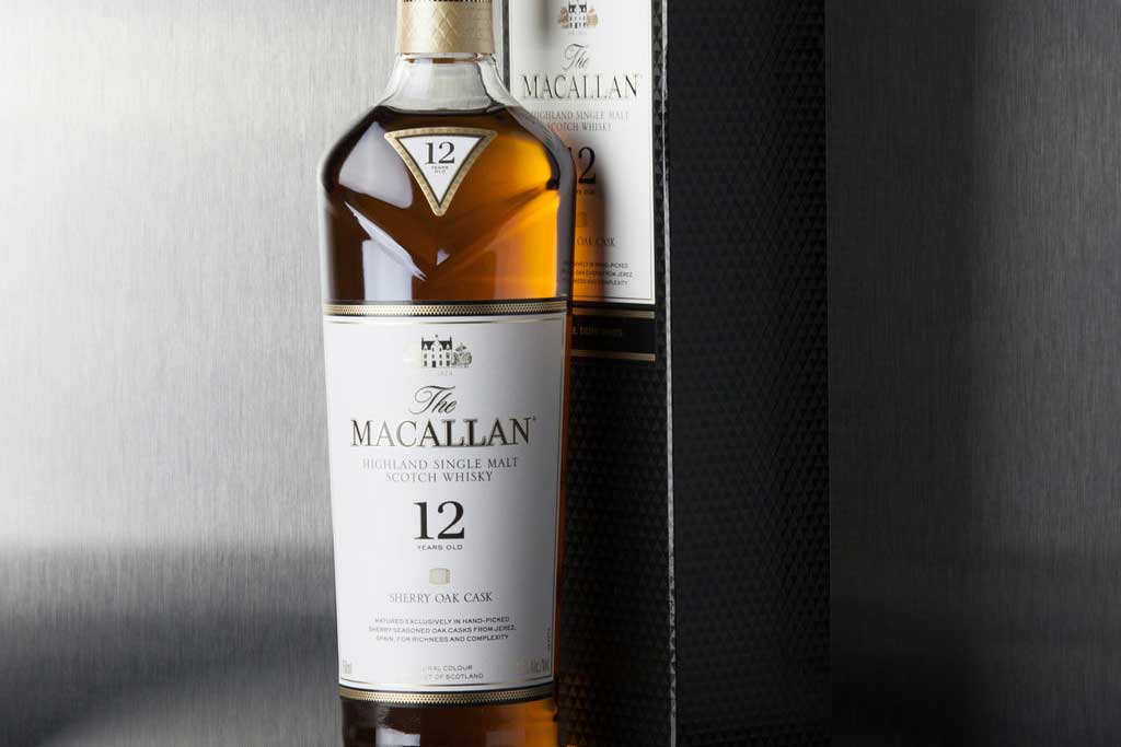 Bottle of Macallan Sherry Oak 12 year old whisky beside its packaging box