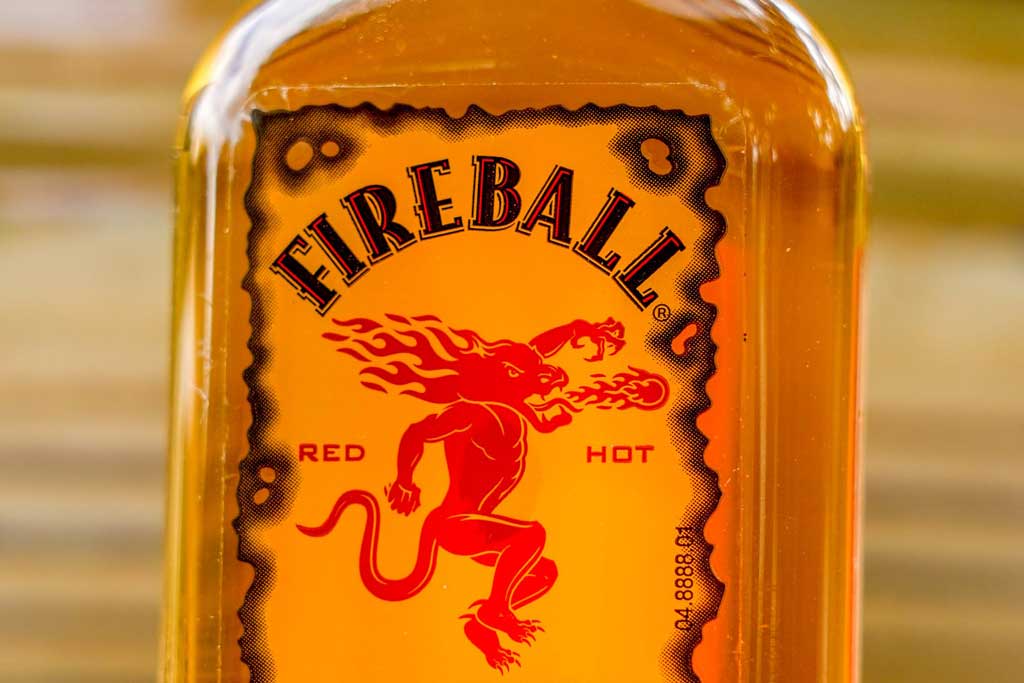 Close view of Fireball cinnamon whisky bottle label