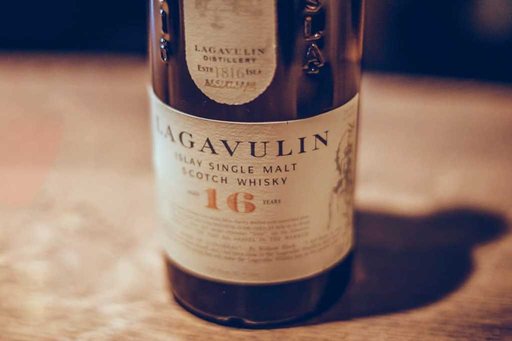 Close view of Lagavulin 16 year old whisky bottle label