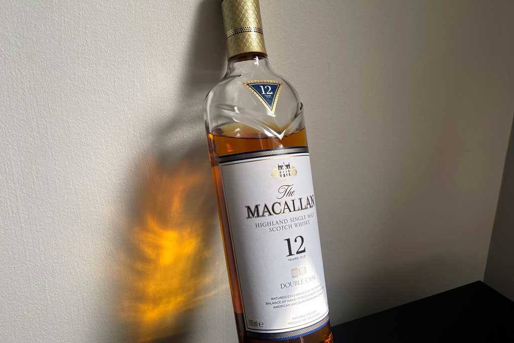 Macallan 12 Double cask leaning against white wall