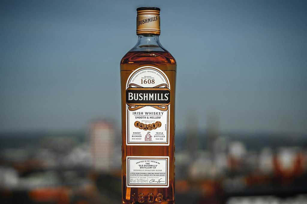 Bottle of Bushmills Original Whiskey outside on sunny day