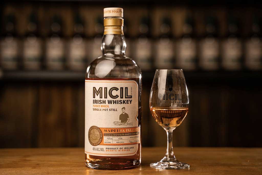 Bottle of Micil Earls Island Single Pot Still Whiskey on bar top