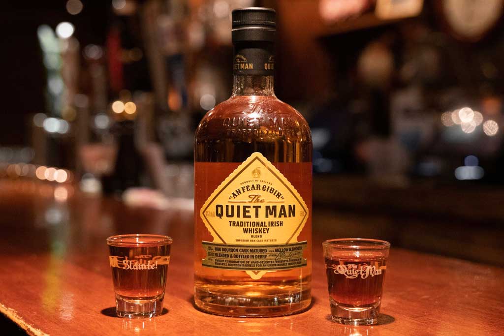 Bottle of The Quiet Man Blended Irish Whiskey sitting on bar top