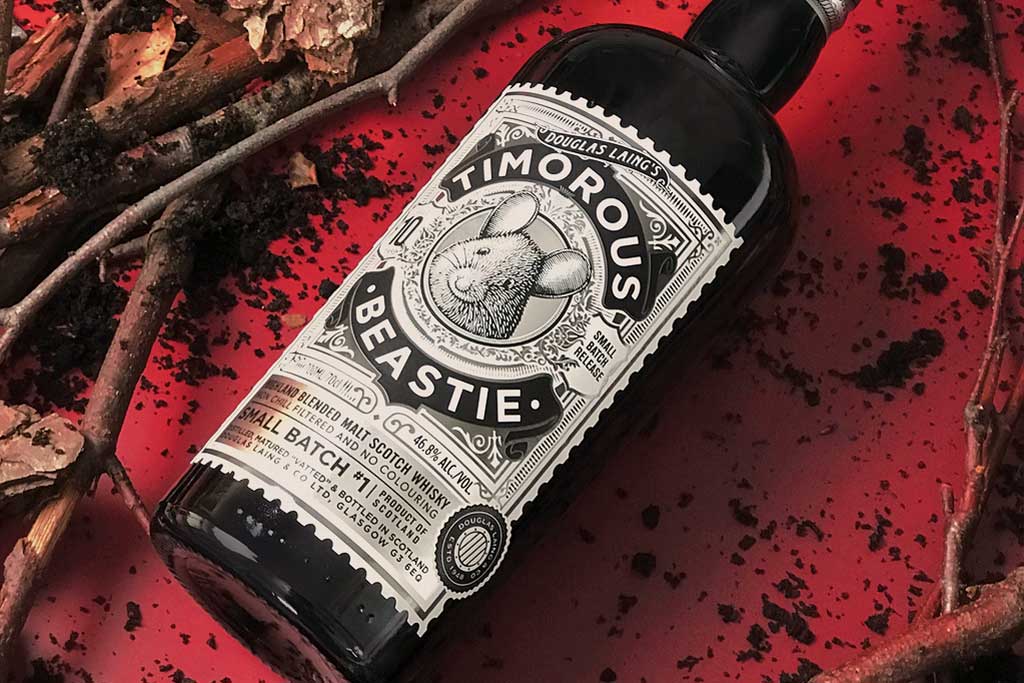 Bottle of Timorous Beastie blended malt Scotch whisky on red table