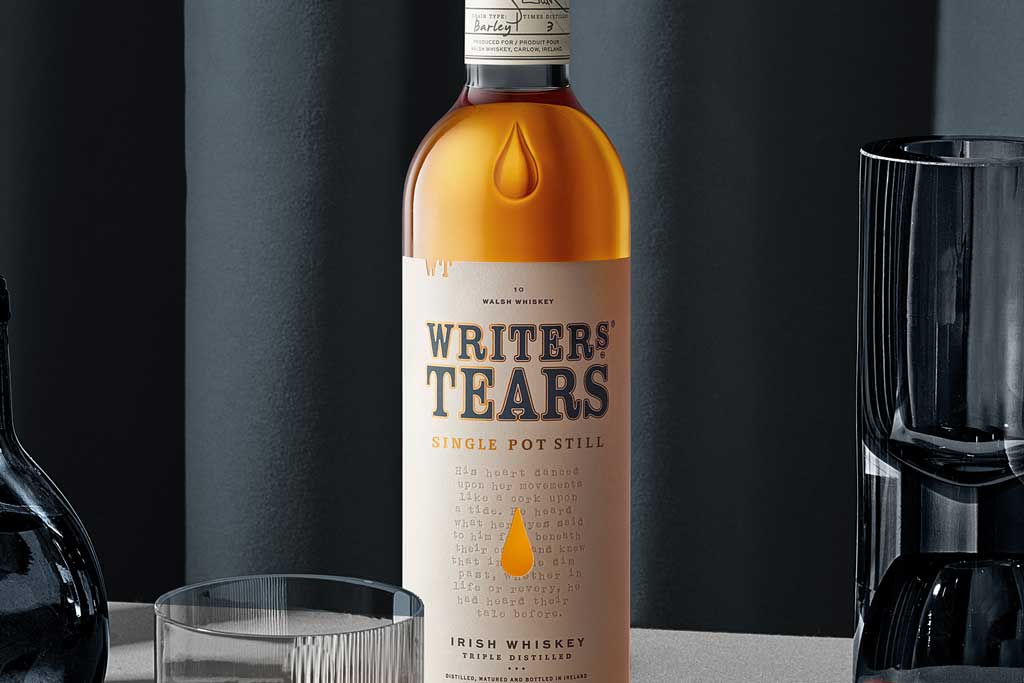 Bottle of Writers Tears Single Pot Still Whiskey in front of grey background