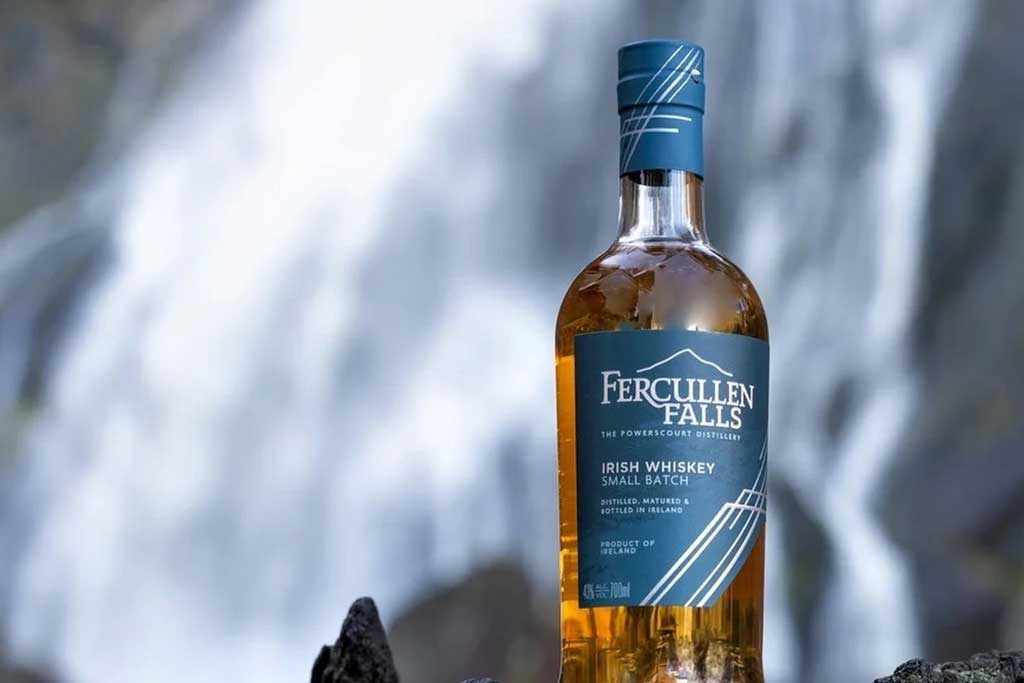 Fercullen Falls Small Batch Blended Irish Whiskey outside in front of waterfall