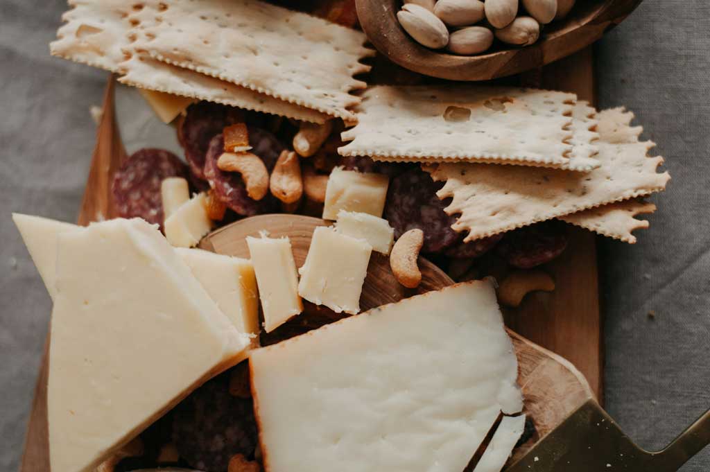 Aerial view of cheeseboard with various nuts