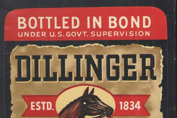 Close view of a vintage Dillinger whiskey bottle label