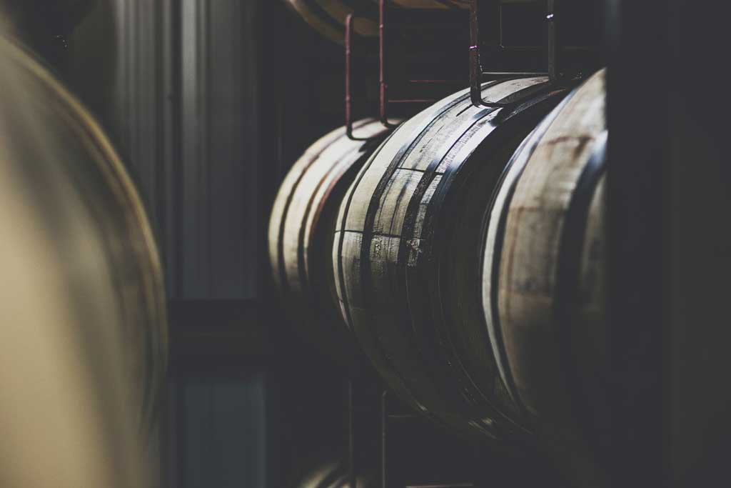 Why is whiskey aged in barrels?